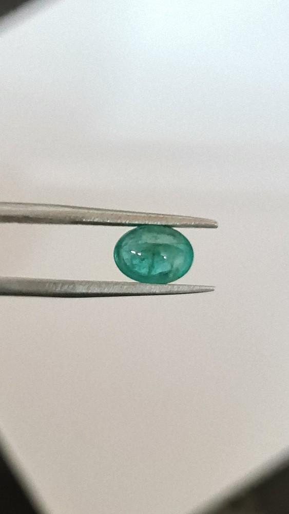 8.24x6.11x4.28mm oval Zambian emerald cabochon with short certification