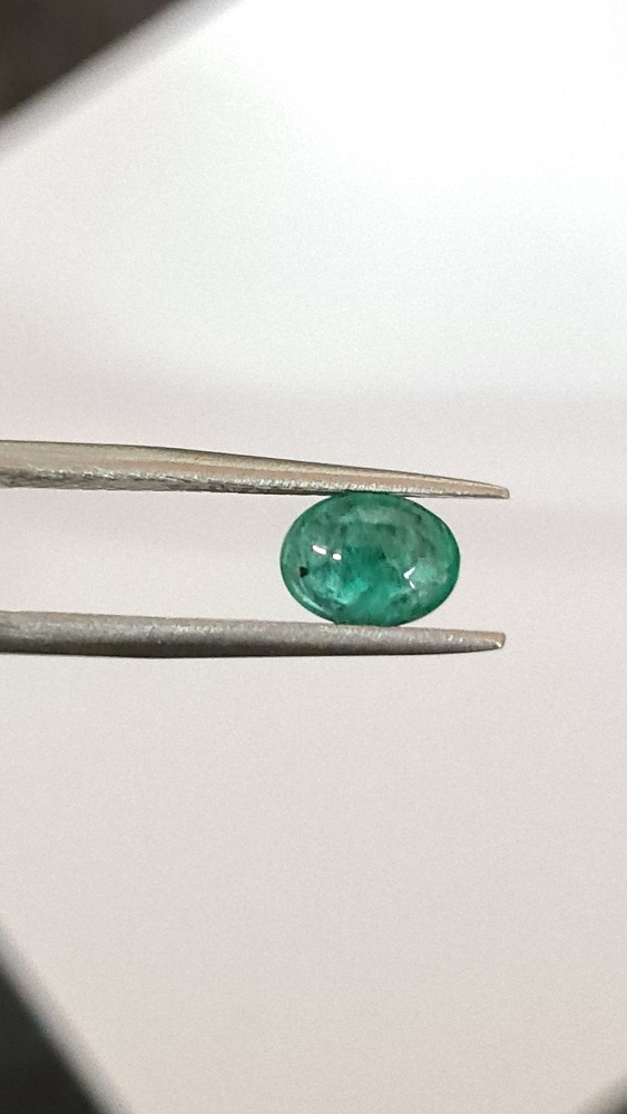 7.97x5.97x4.04mm oval Zambian emerald cabochon with short certification