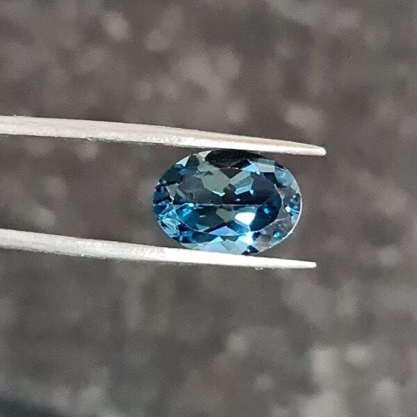 14x10mm oval-cut London-blue topaz facet