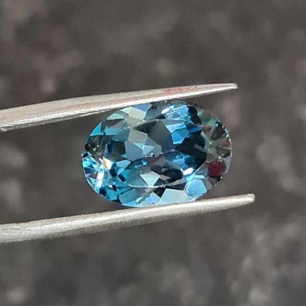 14x10mm oval-cut London-blue topaz facets