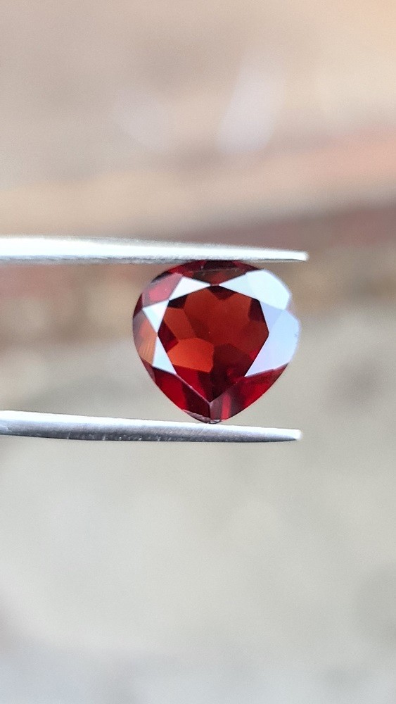 12x11.9mm Brazilian almondine garnet facet