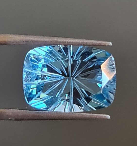 14x10mm carved-back Swiss blue topaz facet
