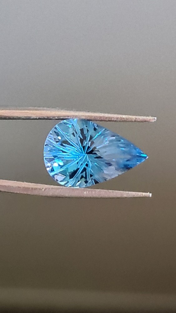 15x10mm carved-back Swiss blue topaz facet