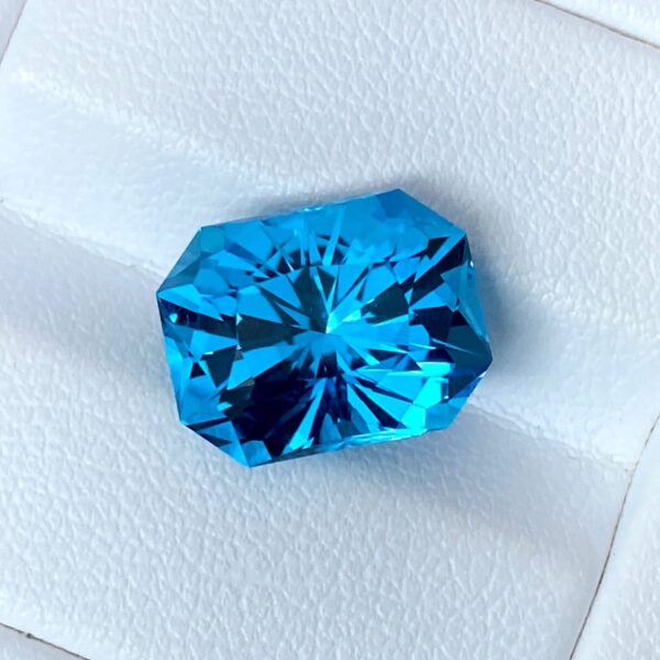 12.64x9.69x8.88mm precision-cut swiss blue topaz facet