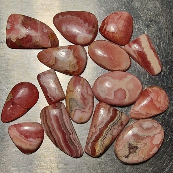 FIFTEEN ring-sized rhodochrosite cabochons