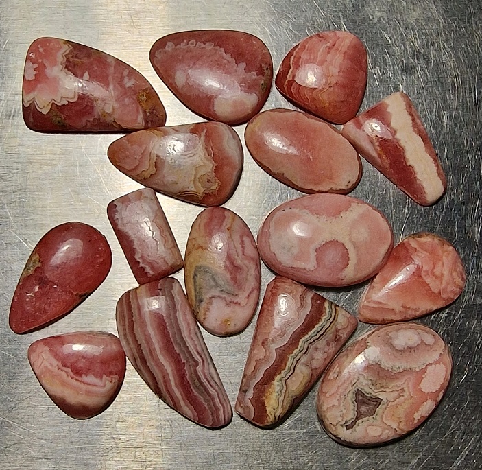 FIFTEEN ring-sized rhodochrosite cabochons