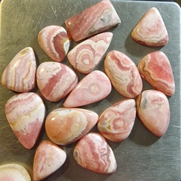 FIFTEEN ring-sized rhodochrosite cabochons