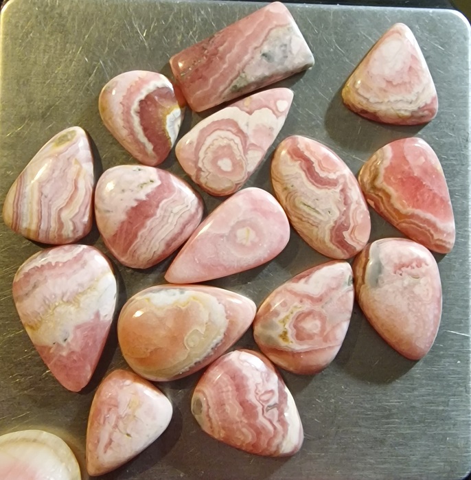 FIFTEEN ring-sized rhodochrosite cabochons