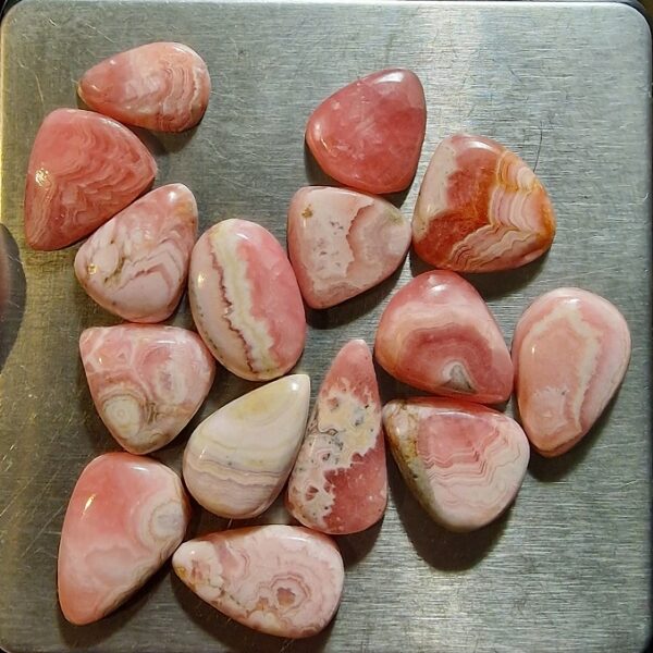 FIFTEEN ring-sized rhodochrosite cabochons