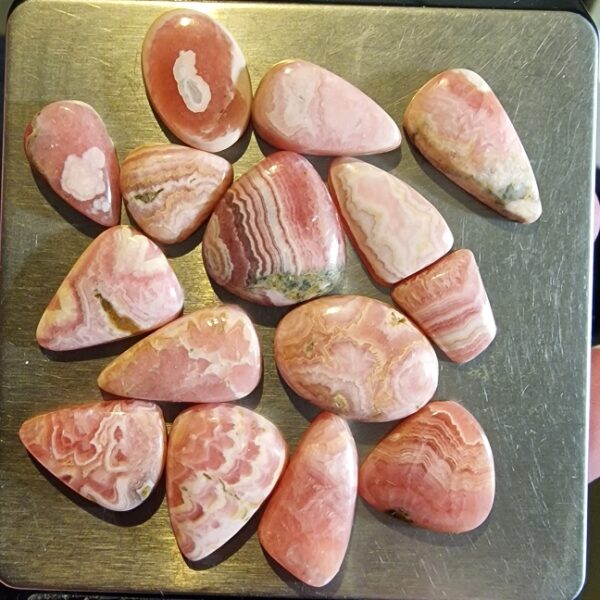FIFTEEN ring-sized rhodochrosite cabochons