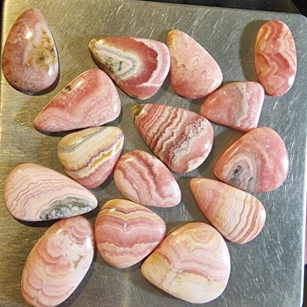 FIFTEEN ring-sized rhodochrosite cabochons