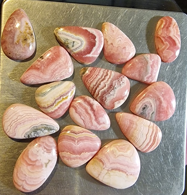 FIFTEEN ring-sized rhodochrosite cabochons