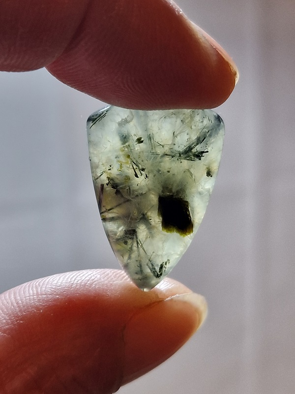 28x20mm prehnite cabochon with rutile inclusions