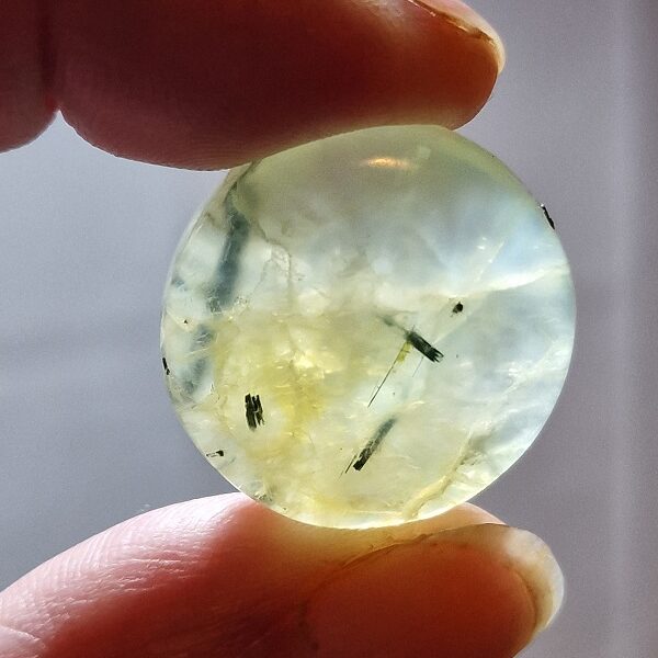 26mm round prehnite cabochon with rutile inclusions