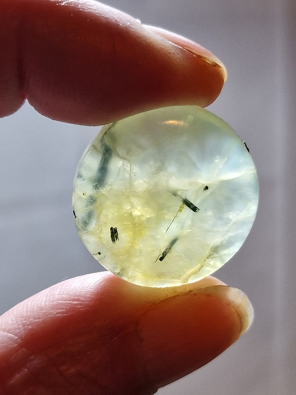 26mm round prehnite cabochon with rutile inclusions