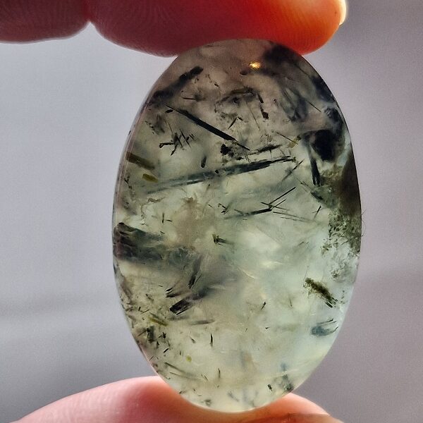 40x25mm prehnite cabochon with rutile inclusions