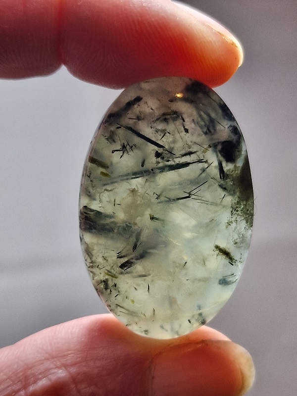 40x25mm prehnite cabochon with rutile inclusions