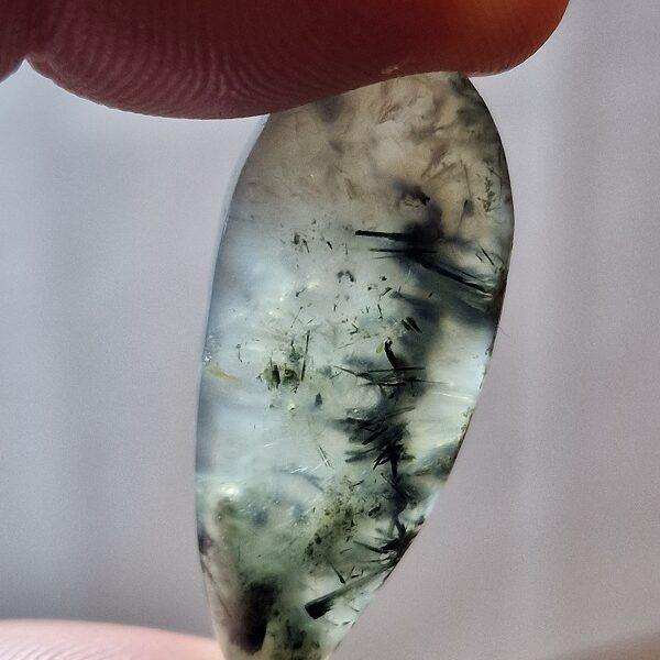 35x15mm prehnite cabochon with rutile inclusions