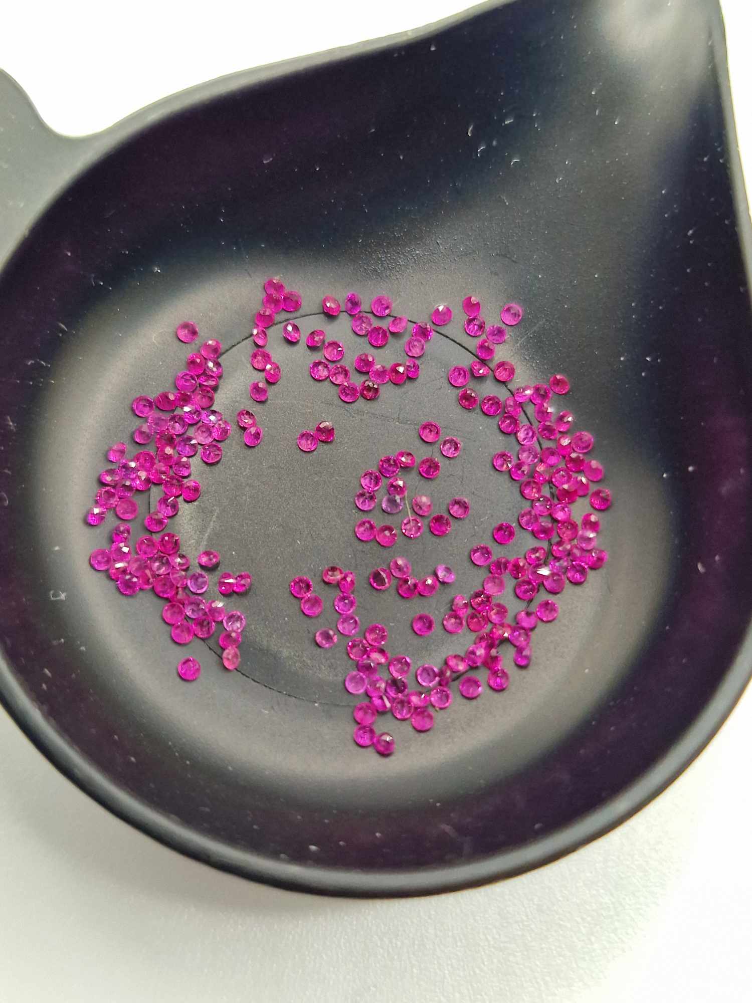 1ct parcels of 1mm Mozambique ruby facets