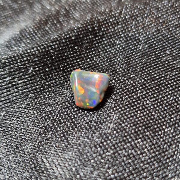 7.9x7.4x5.3mm Ethiopian black opal polished freeform