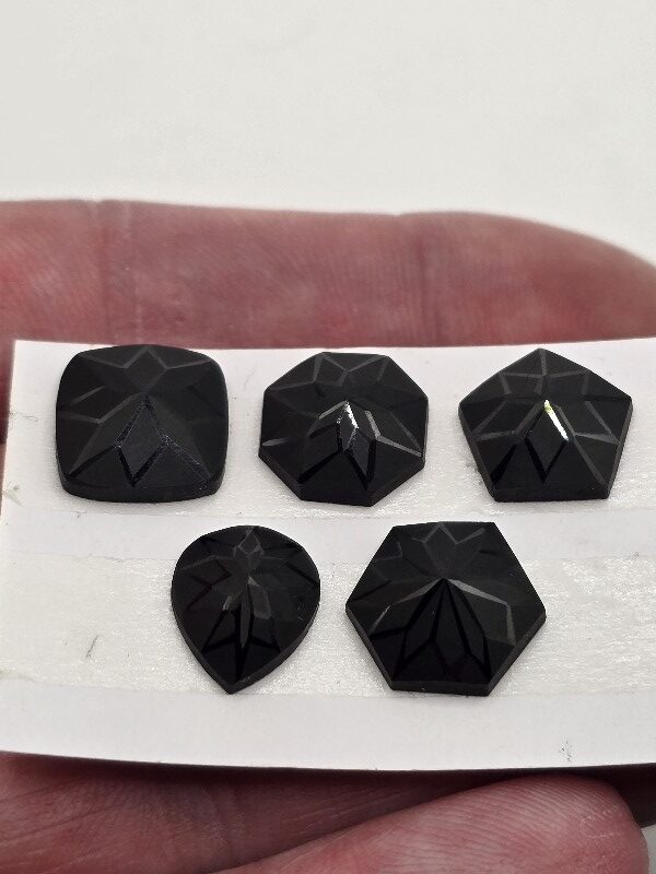 Geometric rose-cut black spinel cabochon parcel