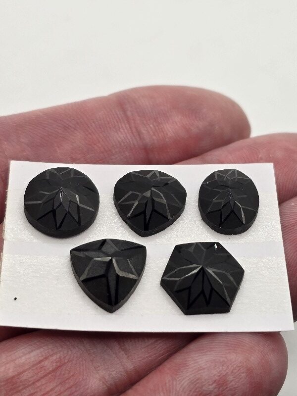 Geometric rose-cut black spinel cabochon parcel