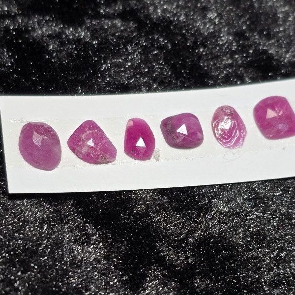 FIVE rose-cut Mozambique ruby cabochons