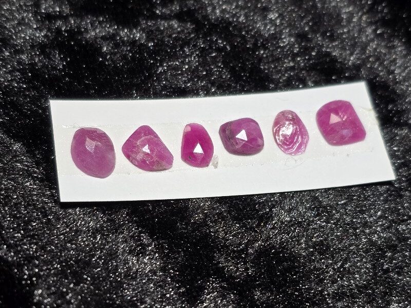 FIVE rose-cut Mozambique ruby cabochons