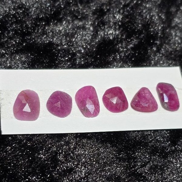 FIVE rose-cut Mozambique ruby cabochons