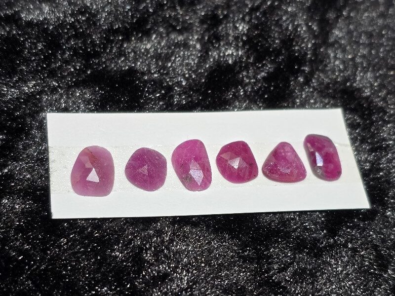 FIVE rose-cut Mozambique ruby cabochons