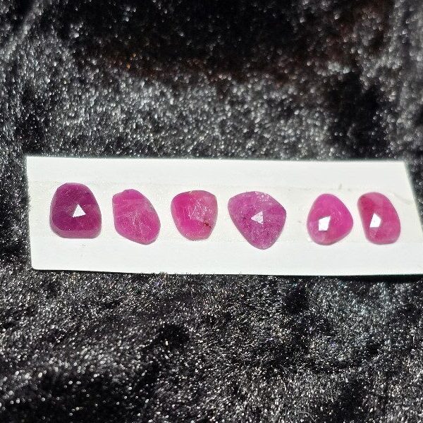 FIVE rose-cut Mozambique ruby cabochons
