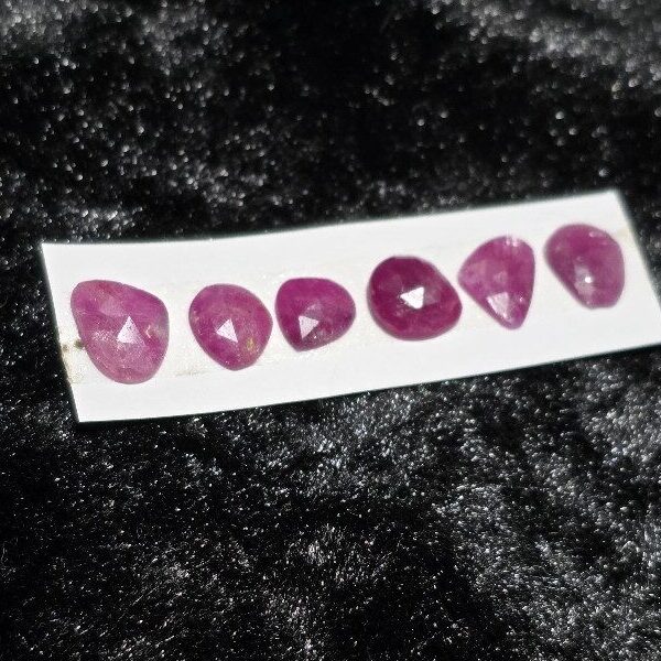 FIVE rose-cut Mozambique ruby cabochons