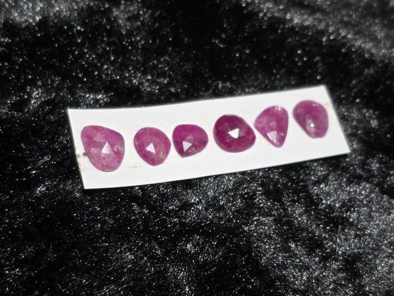FIVE rose-cut Mozambique ruby cabochons