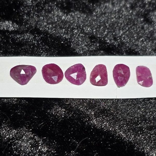 FIVE rose-cut Mozambique ruby cabochons