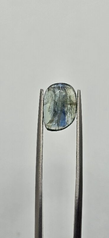 11.2x7.8mm rose-cut bicolour kyanite cabochon