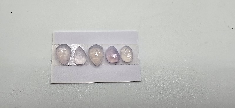 FIVE rose-cut lavender quartz cabochons