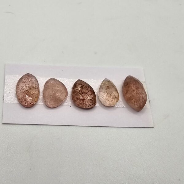 FIVE rose-cut strawberry quartz cabochons