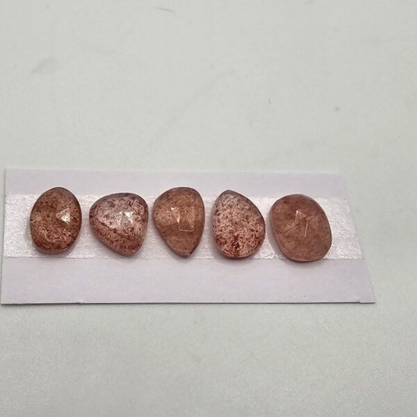 FIVE rose-cut strawberry quartz cabochons