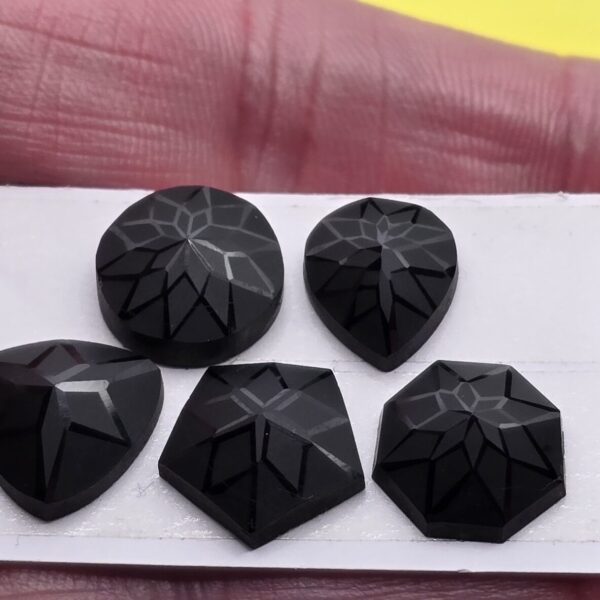 Geometric rose-cut black spinel cabochon parcel