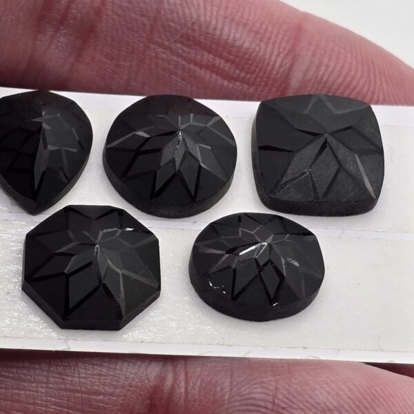 Geometric rose-cut black spinel cabochon parcel