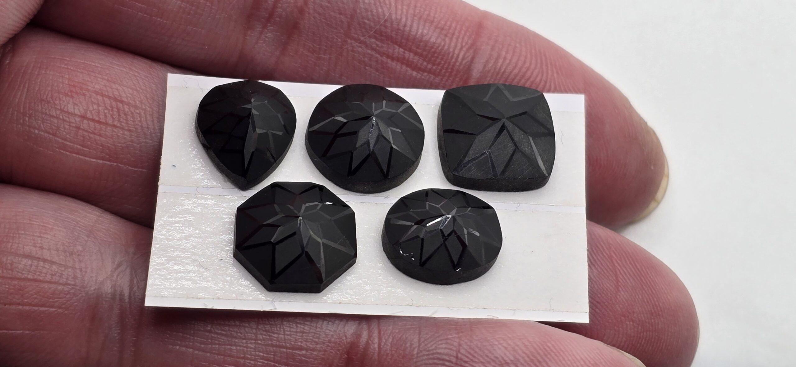 Geometric rose-cut black spinel cabochon parcel