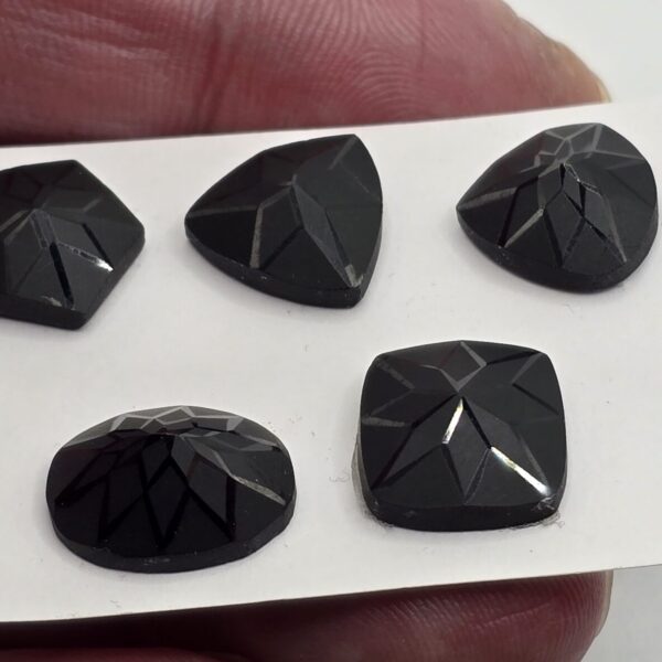 Geometric rose-cut black spinel cabochon parcel