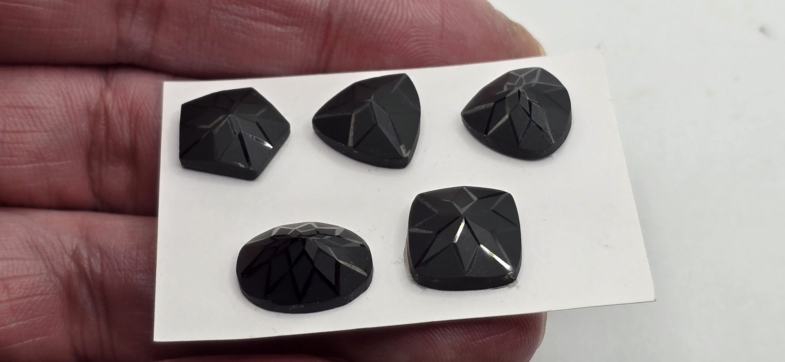 Geometric rose-cut black spinel cabochon parcel