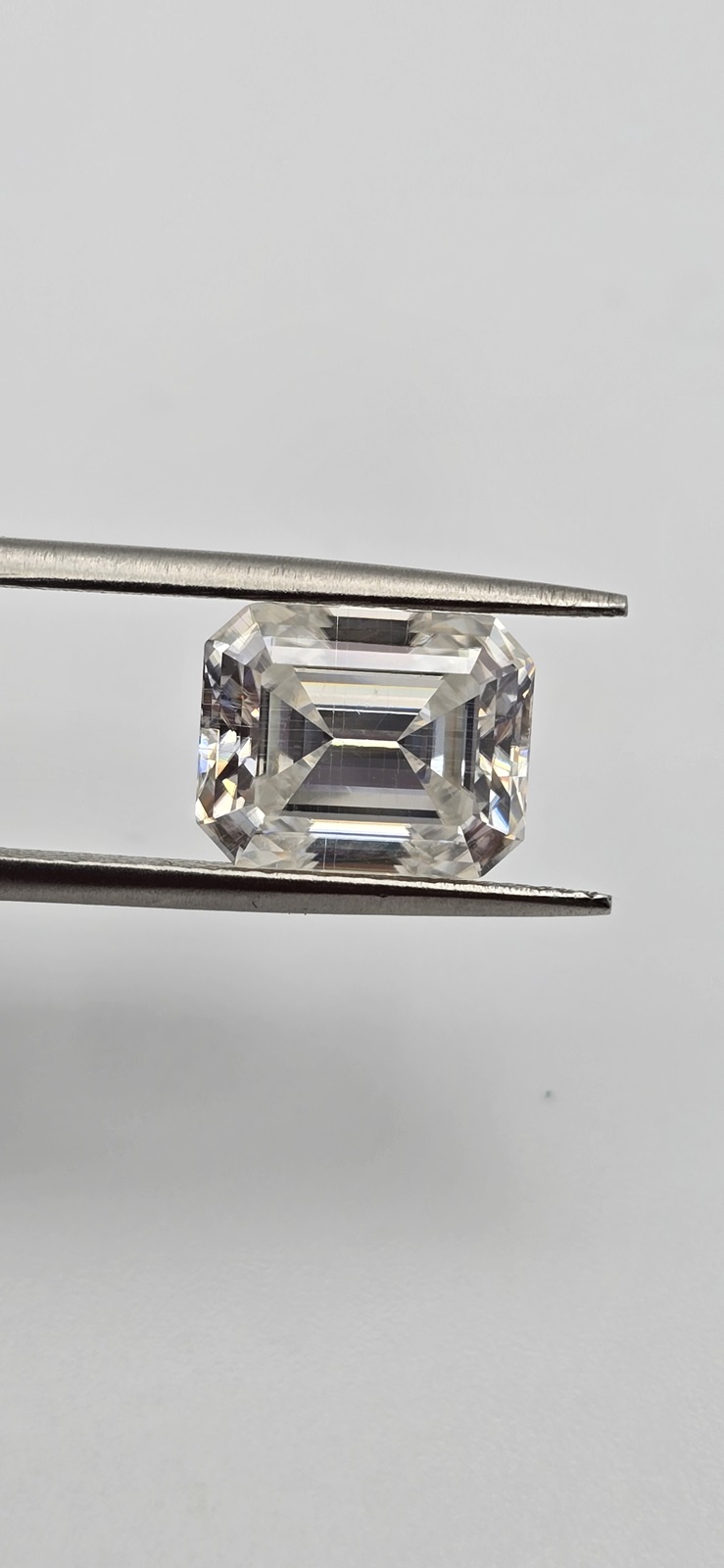9x7mm emerald-cut bright white moissanite facet - budget line