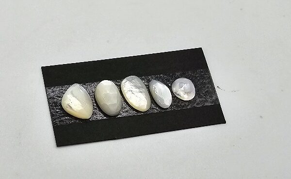 FIVE rose-cut mother of pearl cabochons