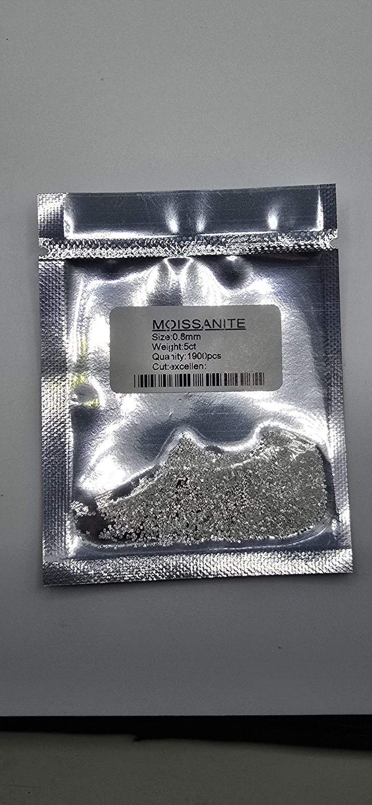 5ct parcel of 0.8mm bright white moissanite melee facets