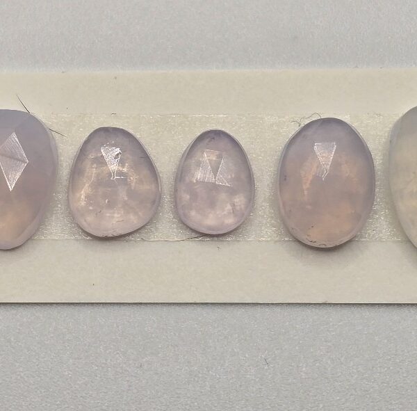 FIVE rose-cut lavender quartz cabochons