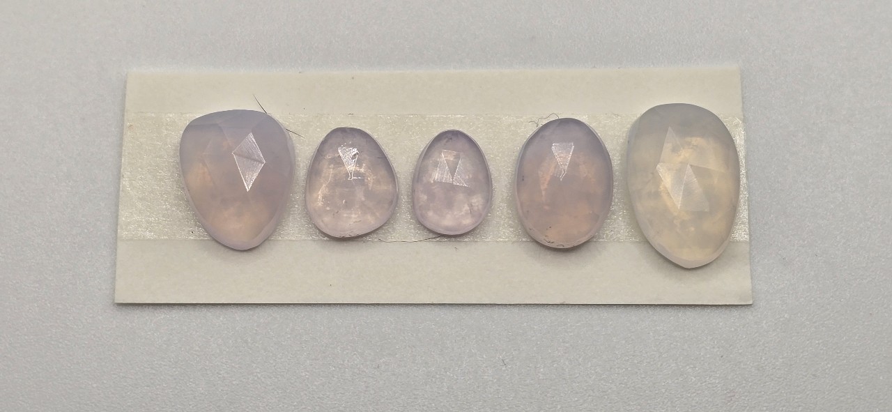 FIVE rose-cut lavender quartz cabochons