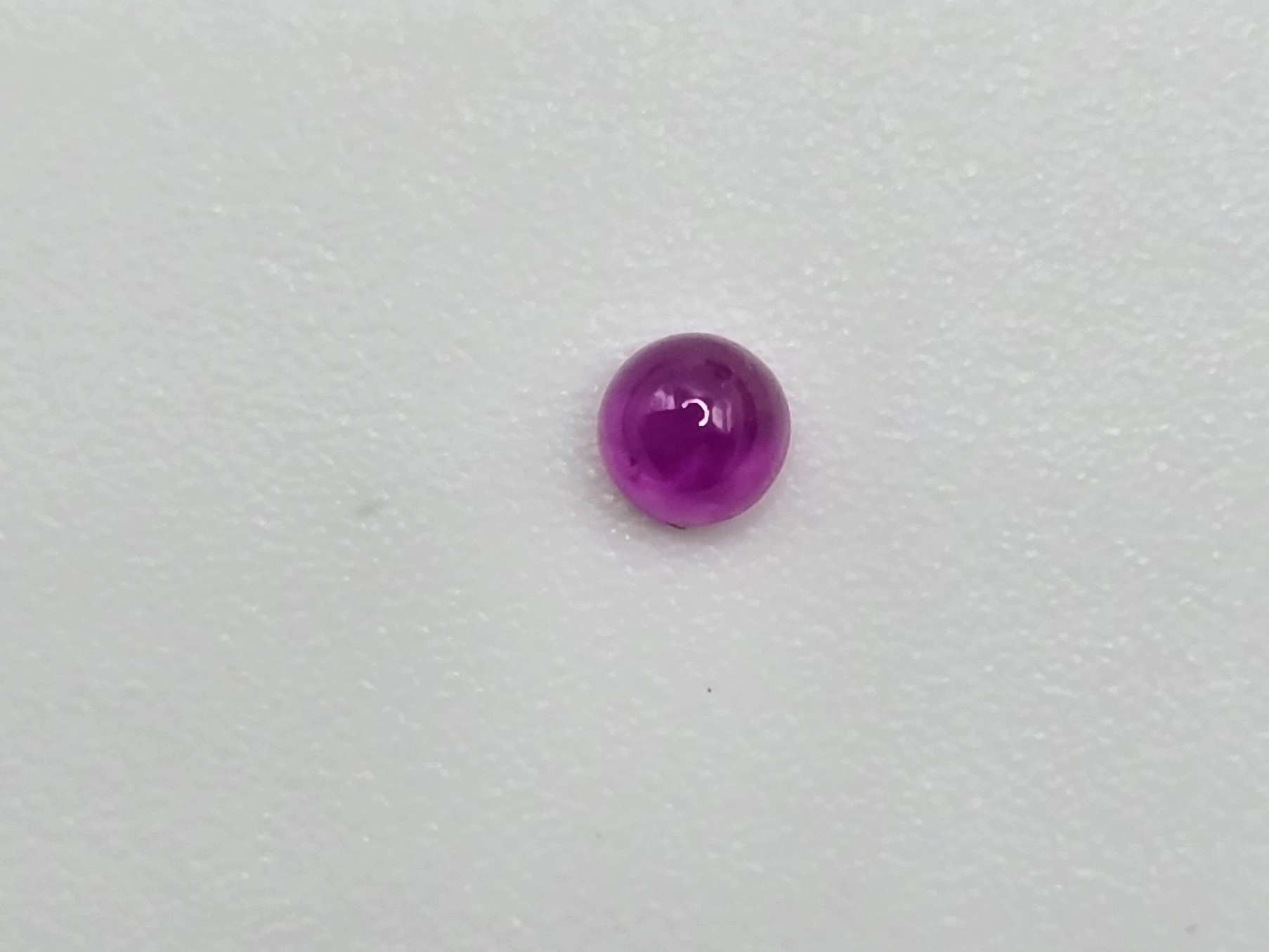 2.59mm round high quality Mozambique ruby cabochon