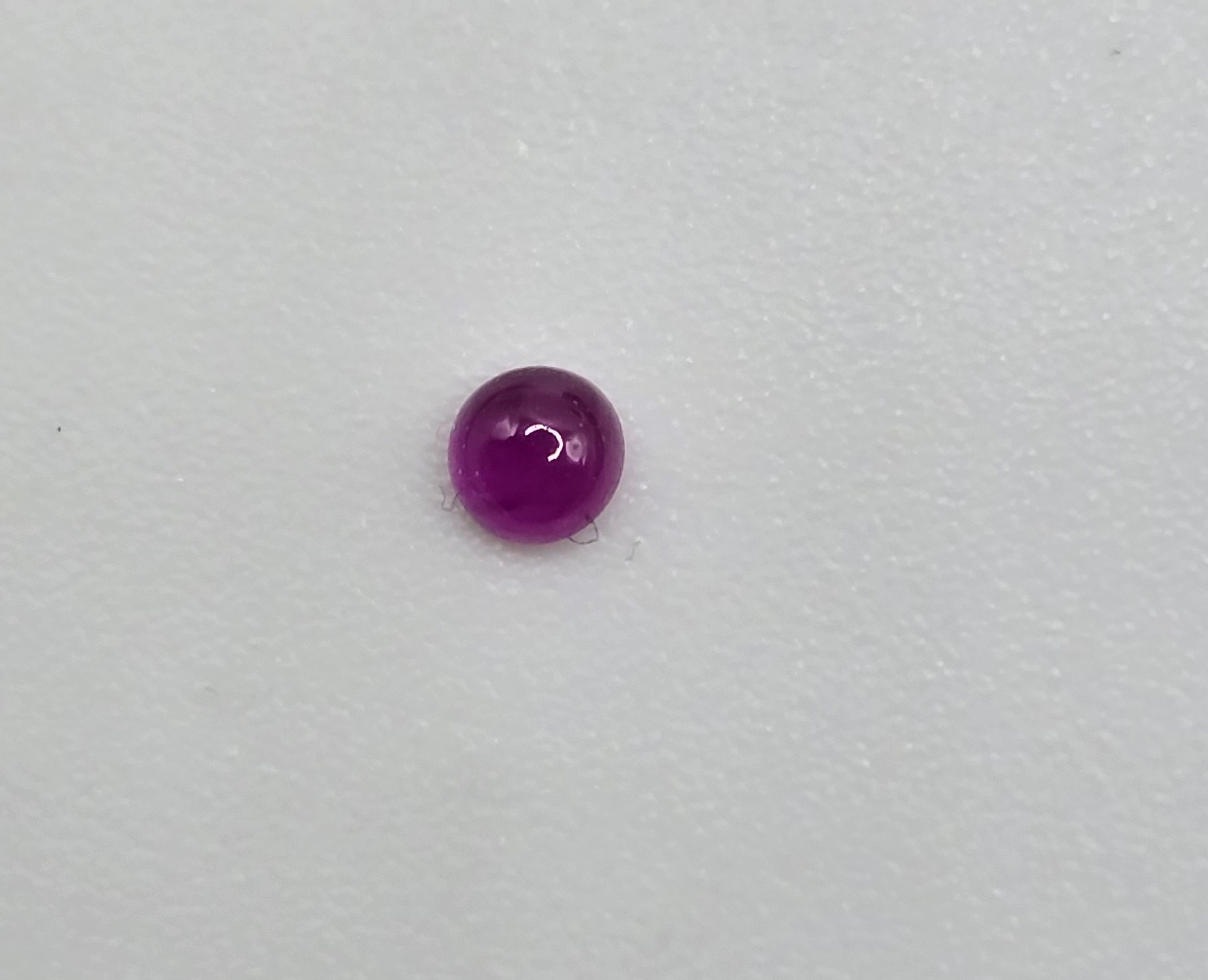 2.55mm round high quality Mozambique ruby cabochon